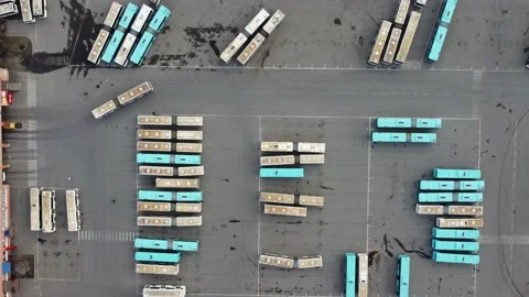 Top down aerial view bus depot and the movement of the articulated bus Stock Footage 178132124