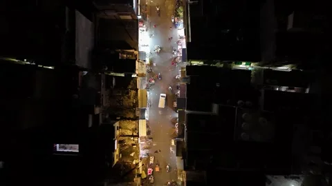 Top-down aerial view of a bustling night street near New Delhi's bazaar. Stock Footage 284692317