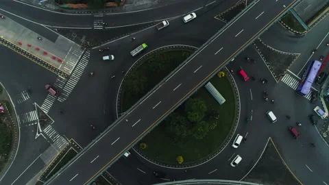 Top down aerial view of busy traffic in intersection bridge flyover road Stock Footage 155305353