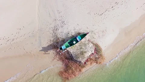 Top down aerial view of canoe resting on sandbank at Noosa River Video stock 335450986