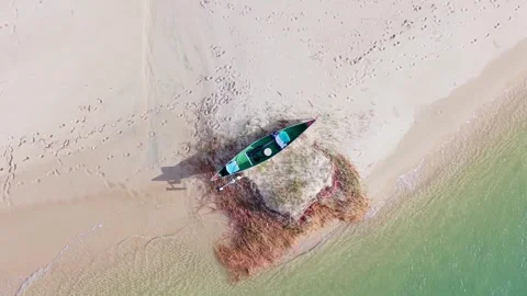Top down aerial view of canoe resting on sandbank at Noosa River Stock Footage 335451574