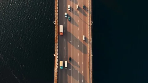 Top down aerial view of car traffic on bridge over river, drone shot Stock Footage 123877179