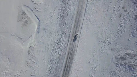 Top down aerial view of car driving on road in volcanic landscape in Iceland. Stock Footage 128670478