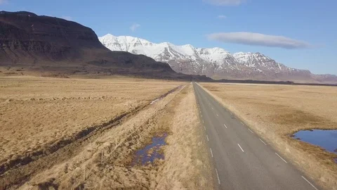 Top down aerial view of car driving on road in volcanic landscape in Iceland. Stock Footage 128727815