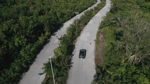 Top down aerial view to car driving on empty roads. Stock Footage 233429775