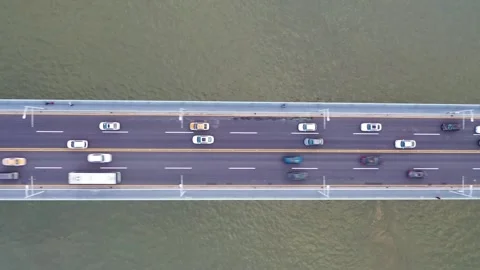 Top Down Aerial View of Car Traffic Crossing River Bridge Video stock 341395774