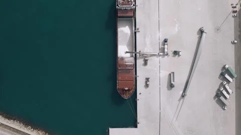 Top Down Aerial View of Cargo Ship Loading Bulk Material at Port Stock Footage 344528906