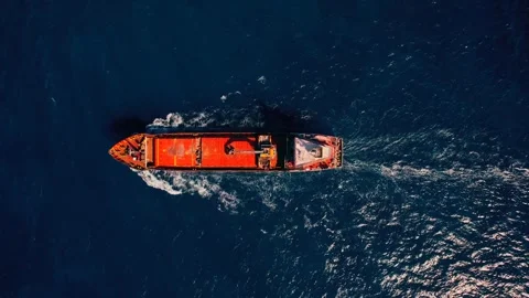 Top Down Aerial View of Cargo Ship Sailing Near Santorini Greece Video stock 345604330