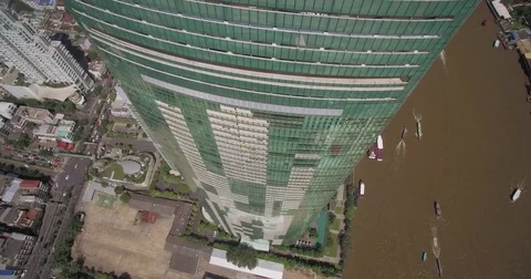 Top-down aerial view of Chao Phraya river-bank with modern condo and hotel devel Stock Footage 73466760