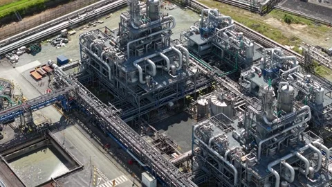 Top Down Aerial View of Chemical Refinery Tanks and Pipework in Hull UK Stock Footage 346139685