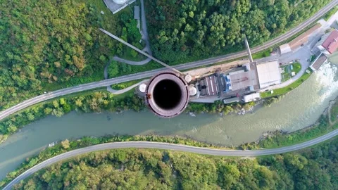 Top-down aerial view of chimney base and surrounding area, Slovenia Stock Footage 325218669
