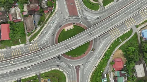 Top down aerial view on a circular intersection in malaysia Stock Footage 268698251