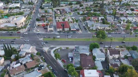 Top down aerial view of city neighborhood businesses and streets Stock Footage 143464372