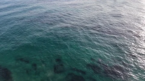 Top Down Aerial View of Clear Turquoise Water and Underwater Rocks Stock Footage 344778151