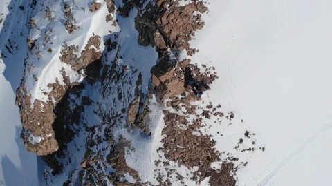 Top down aerial view of climber in snowy mountains Stock Footage 111838296