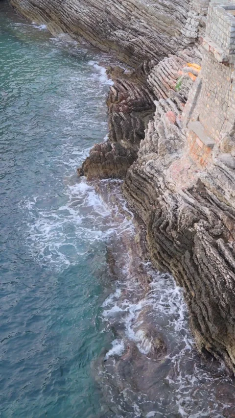 Top down aerial view of coastline, sea and cliffs Stock Footage 280996584