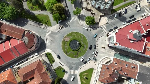 Top-Down Aerial View of a Coimbra Traffic Roundabout With Garden Stock-Footage 345840317