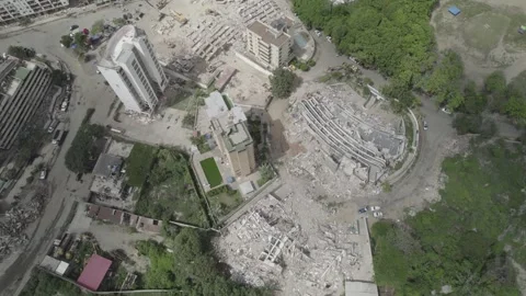Top down aerial view of collapsed buildings and earthquake debris in Stock Footage 340905506