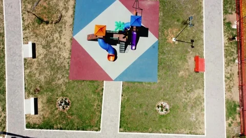 Top down aerial view of colorful playground in public park Paraguay 스톡 동영상 334692887