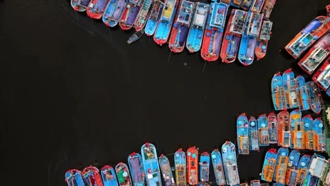 Top down aerial view of colorful fishing boats moored in harbor 動画素材 340875275