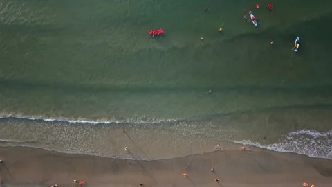 Top down aerial view of colorful kayaks and people in tropical waters Stock Footage 341264242