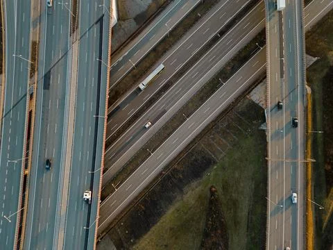 Top Down Aerial View of Complex Highway Interchange and Traffic at Sunset Stock Photos