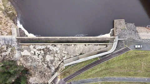 Top down aerial view of a concrete dam and spillway Video stock 340503043