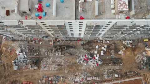 A top-down aerial view of the construction site of a residential building in the Stock Footage 168135076