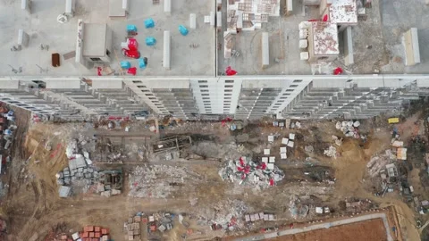 A top-down aerial view of the construction site of a residential building in the Stock Footage 168325460