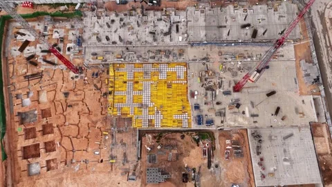 Top down aerial view of construction site foundation work 스톡 동영상 330052263
