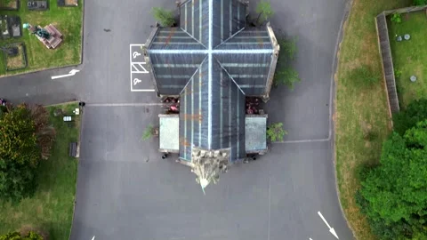 Top-Down Aerial View of Cross-Shaped Gothic Chapel in Cemetery 動画素材 325839166