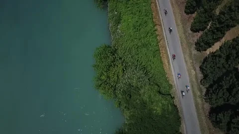 Top-down aerial view of cyclists on a bike path Stock Footage 342333051