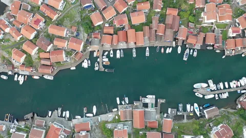 Top down aerial view of dense residential area in a coastal village Stock Footage 137872014