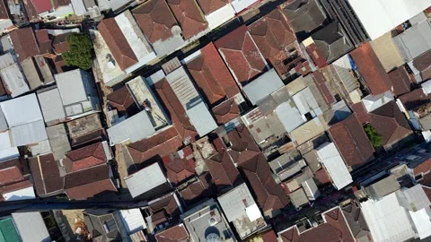 Top-down aerial view of dense residential rooftops in Malang, Indonesia Stock Footage 345396545