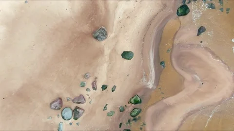 Top down aerial view from drone of calm sea waves crashing and foaming on rock Stock-Footage 143398069