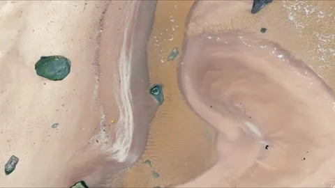 Top down aerial view from drone of calm sea waves crashing and foaming on rock Stock-Footage 143410171