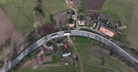 Top-down aerial view drone image on the road through the trees. Cars and trucks Stock Footage 201488905