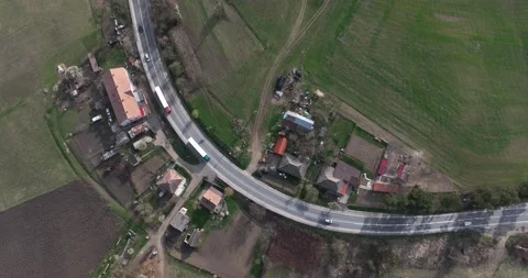 Top-down aerial view drone image on the road through the trees. Cars and trucks Stock Footage 201489342
