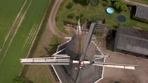 Top down aerial view of Dutch windmill descending revealing texture and Stock Footage 157414604