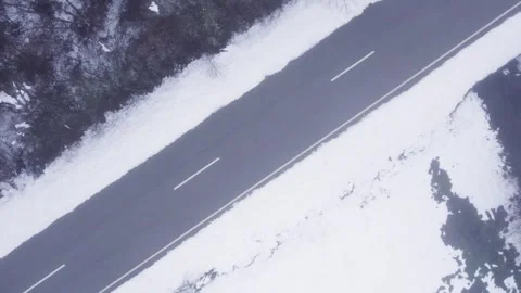 Top Down Aerial View of an Empty Road in Winter The Concept of a Journey Stock-Footage 327836689