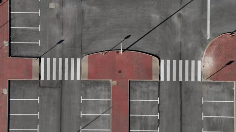 Top down aerial view of empty parking lot and crosswalk street Stockbeeldmateriaal 341810206