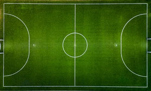Top down aerial view of an empty soccer field, awaiting the joyous moments of Stock Photos