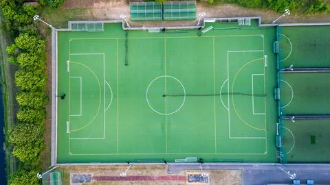 Top down aerial view of an empty football field, awaiting the joyous moments of Stock Photos