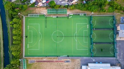 Top down aerial view of an empty football field, awaiting the joyous moments of Stock Photos