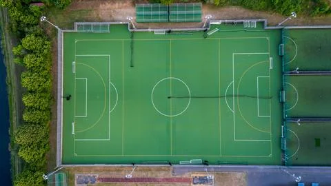 Top down aerial view of an empty football field, awaiting the joyous moments of Stock Photos