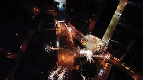 Top Down Aerial View of Fireworks, Exploding Pyrotechnic Above Square and Stock Footage 224936907