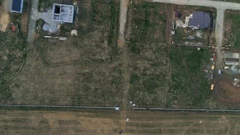 Top down aerial view of free plot for construction in a cottage village Stock Footage 130298745