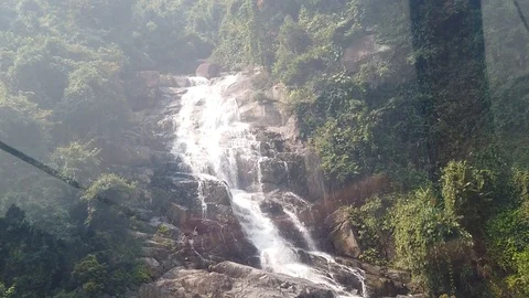 Top down aerial view of giant waterfall flowing in Vietnam mountains filmed in Stock Footage 111461938