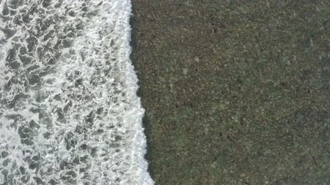 Top down aerial view of giant ocean waves crashing and foaming Stock Footage 135546719