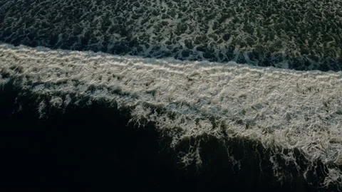 Top down aerial view of giant ocean waves crashing and foaming Stock Footage 150128116